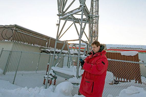 Craig LeBleu tries out his new iPhone in front of the Bell Mobility tower in Cambridge Bay. Representatives from the wireless service provider visited the Kitikmeot community last week to launch a 4G cellular service, as customers lined up to to buy iPhone, Samsung Galaxy, and the newest Blackberry smartphones. Bell Mobility, which is still in the process of taking over Northwestel's Nunavut wireless system, also launched 4G service in Rankin Inlet last week. (PHOTO BY DENISE LEBLEU IMAGES) 

