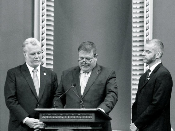 Newly elected Liberal Party of Quebec legislators were sworn in at the National Assembly April 17. Among them was new Ungava MNA Jean Boucher, centre, taking his oath next to Liberal leader and premier-designate Philippe Couillard, at left. 