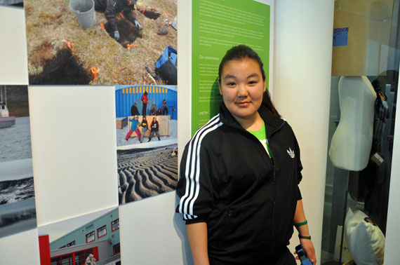 Maggie Irqumia, 17, stands beside a photograph she took in her home community of Akulivik, now on display at Montreal's McCord Museum. Students from Akulivik's Tukisiniarvik school helped launch an exhibit of their work in Montreal April 16, called Sivunitsatinnut ilinniapunga (For our future, I go to school.) Read more about the exhibit later at Nunatsiaqonline.ca. (PHOTO BY SARAH ROGERS) 