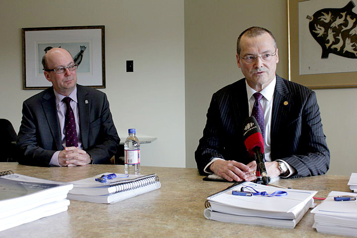 Nunavut Finance Minister Keith Peterson, right, and his deputy minister, Chris D'Arcy, answer questions from media prior to Peterson's delivery of his 2014-15 budget address to the Legislative Assembly May 26. The GN will spend more than $1.5 billion this year with notable increases to the departments of health, family services and education. While it's been a challenge to take the new legislature's mandate, Sivumut Abluqta, and attach actual numbers to programs, Peterson told reporters he believes that the priorities of cabinet — health, education and housing — have been covered. This includes spending $1.3 million to support early childhood education, $1 million to encourage school attendance and $7 million for the Nunavut Housing Corporation, mostly to cover the rising cost of utilities in public housing, and for additional staff housing. See story later on Nunatsiaqonline.ca. (PHOTO BY LISA GREGOIRE)