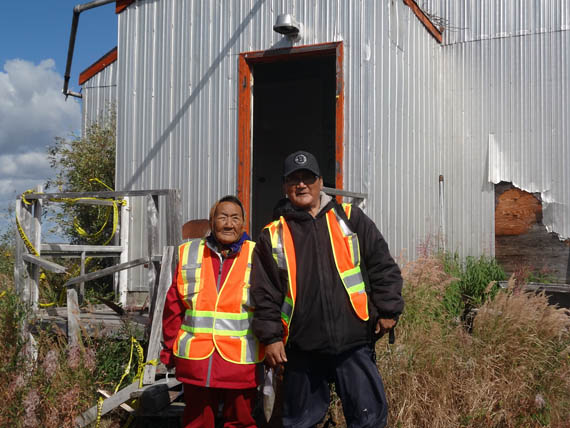 Elder Mary Anowtalik, the only surviving Ahiarmiut who can recall the relocations from  Ennadai Lake, went back to visit the weather station there with her son Paul E. Anowtalik in August 2013. Ahiarmiut hope to see a memorial eventually set up on the site. (PHOTO COURTESY OF AAND)