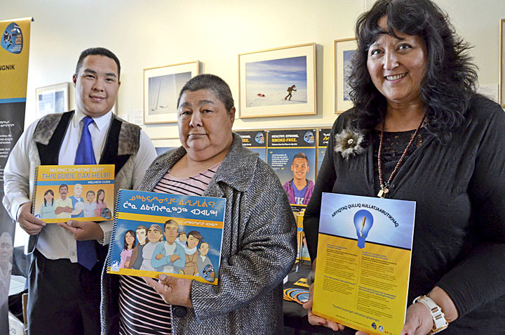 From left: Haley Anawak, an intern with the Inuit learning development program; Monica Ell, Nunavut's health minister; and Frankie Best, tobacco reduction specialist with the Nunavut Department of Health, pose for a photo in front of a Tobacco Has No Place Here campaign booth at the legislative assembly in Iqaluit May 30. World No Tobacco Day falls on May 31, and the Government of Nunavut is hosting activities at the Arctic Winter Games Arena in Iqaluit that day starting at 2 p.m. They're planning snacks, games and tobacco resources on site. To learn more, visit www.nuquits.ca. (PHOTO BY DAVID MURPHY) 