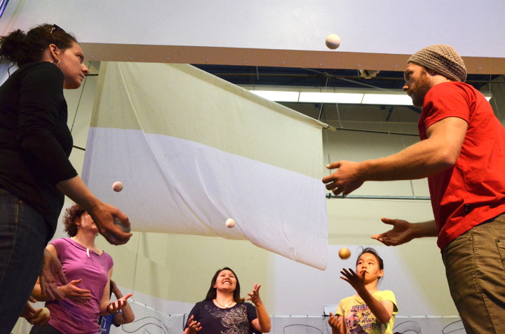 Participants at a free June 29 circus workshop at Nakasuk School try to keep the balls in the air. (PHOTO BY DAVID MURPHY 