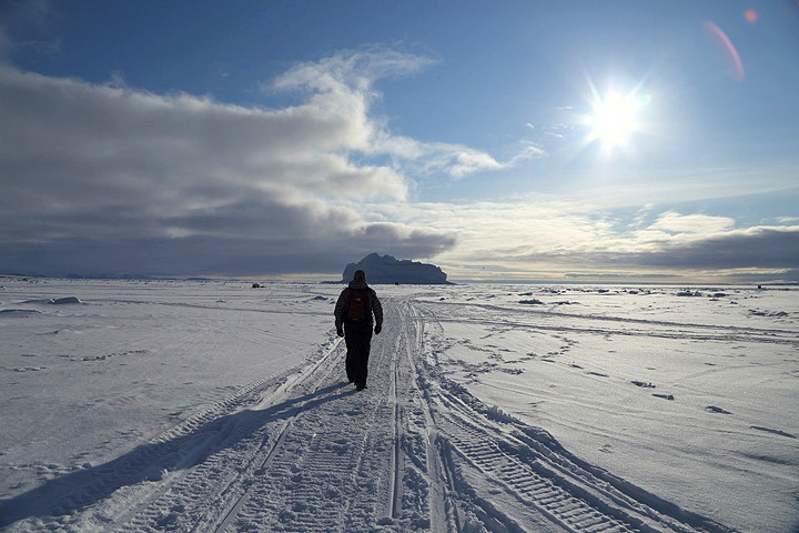 Pangnirtung-based photographer Sarah McMahon was visiting Pond Inlet recently and snapped this shot May 23 of her friend during an evening walk to an iceberg frozen into the sea ice offshore. When they got there, others had also gathered and were chipping chunks off to bring home for tea. (PHOTO BY SARAH MCMAHON)