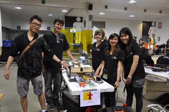Skills Iqaluit robotic club members, from left, Jack Lau, Izaac Wilman, Matilda Pinksen, Lisabeth Demavivas and Elaine Lau pose with their robot, named Porta Rican Thunder Goddess, built at the Skills Canada competition last week. (PHOTO BY SARAH ROGERS)