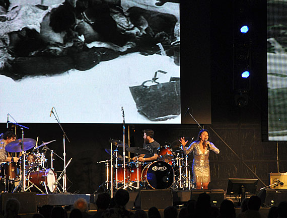 Throat singer Tanya Tagaq of Cambridge Bay on stage at the Luminato festival in Toronto June 10, with the film Nanook of the North as a backdrop. Tagaq performed a soundscape she was was commissioned to do in 2012 as an audio stream for Robert Flaherty's 1922 silent film, which depicts the family life of an Inuk man who Flaherty called Nanook in the Inukjuak area of what is now called Nunavik. Tagaq just released her third album, Animism. (PHOTO BY SARAH ROGERS)