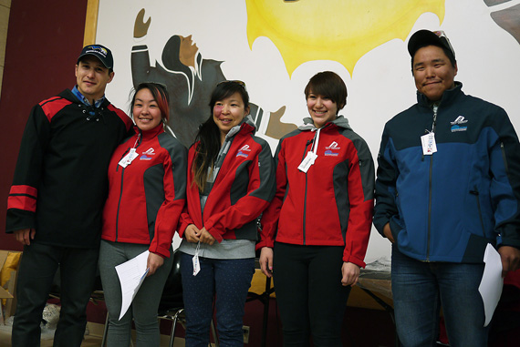 NHL right winger Jordin Tootoo presents jackets to Kugluktuk high school graduates Darla Evyagotilak, Kristy Mannilaq, Keisha Westwood and Allan Junior Kudlak June 16. Kugluktuk was Tootoo's first stop on a tour of the Kitikmeot region to speak with local youth. (PHOTO BY JESSE AJAYI)
