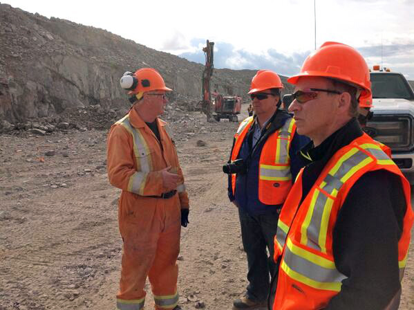 Nunavut Premier Peter Taptuna, centre, is pictured here visiting the site of Baffinland's Mary River iron ore project this past weekend, along with his new principal secretary Ed Picco, right and a Baffinland employee. The Nunavut Impact Review Board has approved Baffinland Iron Mines’ early revenue phase proposal, which could see up to 4.2 million tonnes of iron ore per year shipped from Mary River via Milne Inlet to markets in Europe. Taptuna also stopped in Pond Inlet to present the community the Council of the Federation Water Stewardship Award for the community's work monitoring its fresh water quality. (PHOTO COURTESY OF THE GN)