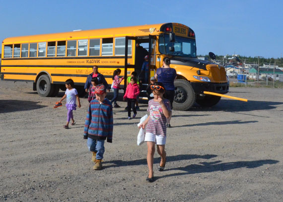 Students leave their school bus and file into their first day of classes at Pitakallak school in Kuujjuaq Aug. 21. The Kativik School Board`s roughly 3,000 students across Nunavik began the 2014-15 school year this week. (PHOTO BY ISABELLE DUBOIS)