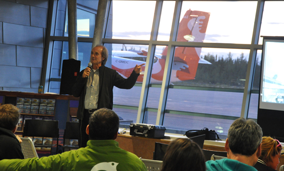 Robert Piché, the Quebec pilot made famous in 2001 when he safely landed an Airbus 330 in the Azores after it ran out of fuel, speaks to a crowd at the Kuujjuaq airport Sept. 11. Piché was invited to Nunavik to speak to a group of airport observers who are training in Kuujjuaq this week. His advice to them: communication is key. Piché also recounted the last harrowing 20 minutes of Air Transat Flight 236, when the plane's engines shut down and Piché guided the aircraft and its 306 passengers to a safe landing. (PHOTO BY SARAH ROGERS)