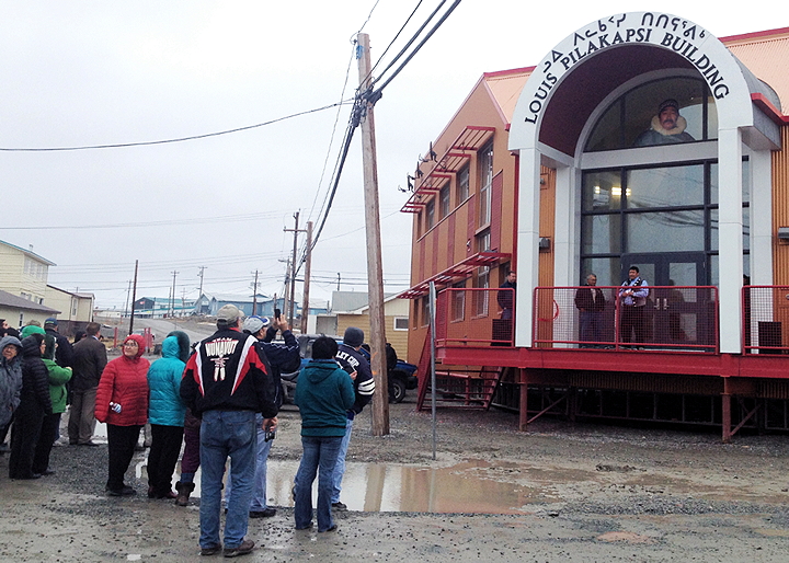 David Ningeongan, Kivalliq Inuit Association president, speaks to a crowd in Rankin Inlet Oct. 8, during the KIA’s building dedication to the late Louis Pilakapsi who died in a boating accident in 2000. A respected leader, Pilakapsi had a long career serving Kivallirmiut including such jobs as president of the Aqiggiaq Hunters and Trappers Organization, vice-chair of the Keewatin Wildlife Federation, deputy mayor of the Hamlet of Rankin Inlet, and board director with the Kivalliq Inuit Association and Nunavut Tungavik Incorporated. He was also a member of the Canadian Rangers. The KIA moved into their new offices earlier this year in a building which also houses Sakku Drugs, owned by Sakku Investments Corporation. (PHOTO BY DOUG MCLARTY/ARCTECH DESIGN AND SERVICES)
 