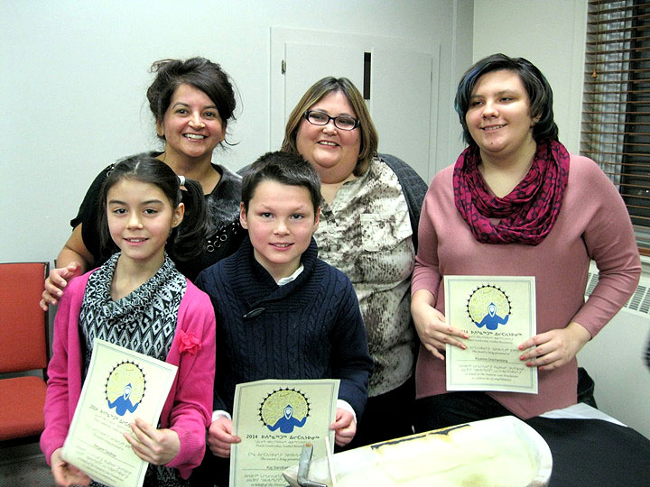 Nalini Vaddapalli and Mandy Sammurtok, centre, of the Nunavut Law Foundation with three of this year’s eight winners of the Upinnaqtuq Award, which the foundation gives annually to Nunavut youth who demonstrate qualities of leadership, conflict resolution, or “remarkable progress” in rehabilitation. Nanook Elementary School students Margaret Gauthier, left, and Kaj Sandbakken celebrated their win at the Frobisher Inn in Iqaluit, Nov. 14, with fellow Iqaluit resident Kiyanna Drachenberg, right, a student of Inuksuk High School. Each received $500 with their certificates. Other winners for 2014 included Hayden Hickey and Aloka Wijesooriya of Iqaluit, Etuangat Akeeagok of Grise Fiord, Scott Kiluksishak of Pond Inlet, and Veronica Uttak of Repulse Bay. (PHOTO BY PETER VARGA)
