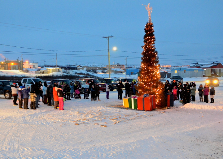 Kuujjuammiut gather Dec. 20 for the annual lighting of the community Christmas tree. This year, the honour of turning the lights on went to elder Tommy Gordon Sr. After the lighting, Kuujjuaq Mayor Tunu Napartuk lead the crowd in an Inuktitut version of the traditional carol 