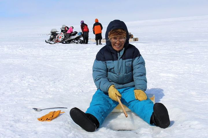 As 2014 winds down today and a new year begins, we look back over good times and look forward to a new year as well. This photo of Igloolik's Leonie Qrunnut was taken during Igloolik's popular spring fishing derby held north of the Melville Peninsula and was recently uploaded to Inuit Hunting Stories of the Day, a popular Facebook page that celebrates Inuit culture on the land. During the long, dark days of January and February, we can look forward to springtime on the land and on the ice. (PHOTO BY RICHARD AMARUALIK)
