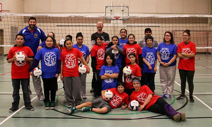 Students in Cambridge Bay pose Dec. 11 with Scott Schultz, far left, and Larry McKay, back row, at the end of a high performance volleyball clinic held at Kiilinik high school. Schultz and McKay, both connected to the Canadian National Volleyball teams as coaches, put on the clinic in the western Nunavut hub to teach local kids the ins and outs of a the game. See story later on nunatsiaqonline.ca. (PHOTO BY KELCEY WRIGHT)