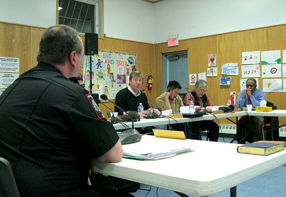 Iqaluit’s chief of municipal enforcement, Kevin Sloboda, takes a question about the city’s animal control policy from councillor Terry Dobbin, centre, at a city council meeting held at Abe Okpik Community Hall in Apex Jan. 13. (PHOTO BY PETER VARGA)

