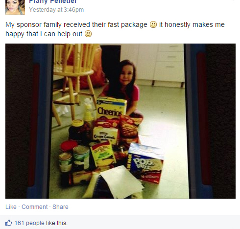 The Facebook group Helping Our Northern Neighbours is filled with images like this: Nunavummiut families posing with the food packages they've received. (FACEBOOK IMAGE) 