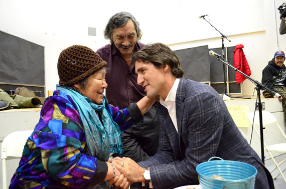 Alacie Joamie of Iqaluit and Justin Trudeau share an affectionate moment at a community event held Jan. 12 in Iqaluit. (PHOTO BY JIM BELL)