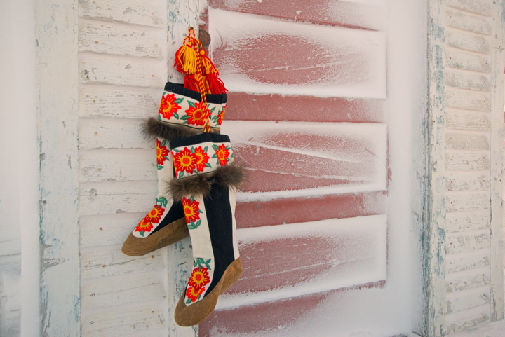 A pair of vibrantly coloured kamiks provide the perfect contrast for a snowy wooden wall. Cambridge Bay photographer Denise Lebleu borrowed the embroidered kamiks from a friend who got them as a gift. The seamstress, who used moose hide for the feet, hails from Paulatuk, Northwest Territories, she said. Lebleu said she hung the kamiks from the historic Hudson Bay Company historic, across from the Cambridge Bay Visitor's Centre, to showcase the intricate handiwork. (PHOTO BY DENISE LEBLEU IMAGES)