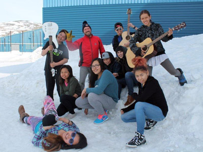 Youth Fusion music instructors Geneviève Bernier and Alan Dicknoether pose with their music students outside of Ikusik school in Salluit. Youth Fusion is one of 14 projects funded by Nunavik's Esuma initiative. (PHOTO COURTESY OF YOUTH FUSION)
