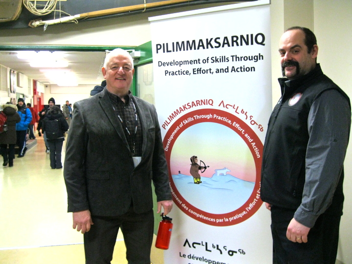 Terry Young, president of the Nunavut Teachers' Association, left, and Cody Prusky, conference coordinator, take a breather during a lunch break at the Pilimmaksarniq 2015 teachers' development conference, Feb. 18, at Inuksuk High School in Iqaluit. Some 329 teachers from schools across the Qikiqtani region – from as far north as Grise Fiord to Nunavut's most southerly hamlet, Sanikiluaq – gathered for five days of workshops and presentations centred on themes of literacy and cultural development, Prusky said. The conference wraps up Feb. 20. (PHOTO BY PETER VARGA)