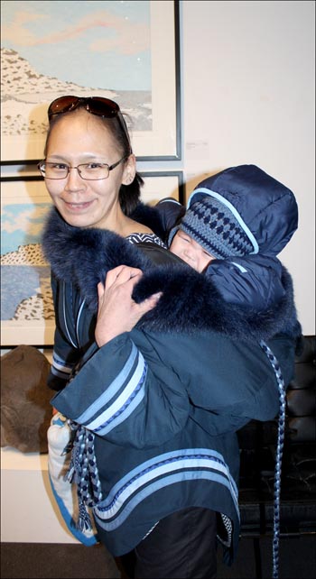 Cape Dorset artist Nicotye Samayualie and her infant son Norman attend the opening night of solo exhibition at Toronto's Feheley Fine Arts Feb. 28. (PHOTO COURTESY OF FEHELEY FINE ARTS) 