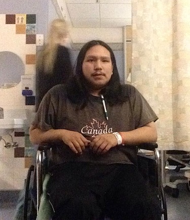 Bradley Ikkutisluk of Gjoa Haven sits in a wheelchair in an Edmonton hospital before undergoing chemotherapy for the blood cancer, leukemia. (PHOTO COURTESY OF B. IKKUTISLUK)