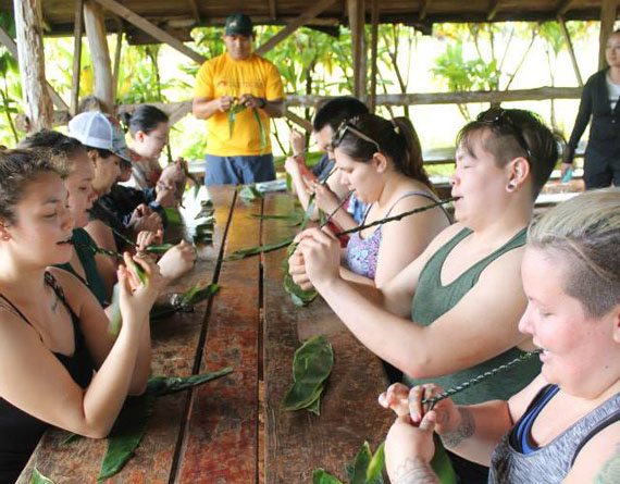 Students and staff from the Ottawa-based Nunavut Sivuniksavut are in Hawaii for their end of year trip, where they were taught how to braid lei — a traditional Polynesian garland of flowers — in Hawaii's North Shore region May 5. (PHOTO COURTESY OF NS)