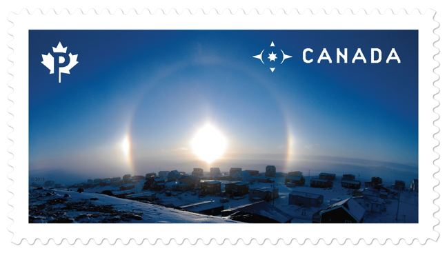 A photo of a 2012 sundog above Iqaluit will be stuck to your envelopes soon enough. Photographer Frank Reardon snapped this photo outside his house and sent it into The Weather Network one December day. Three years later, it's on stamp. “I was just amazed. I was shocked when Canada Post contacted me and told me they want to put my photo on a stamp. At first I thought it was a joke,” Reardon told Nunatsiaq News. Read more about how the photograph, and the stamp, came to be, later on NunatsiaqOnline.ca. (PHOTO COURTESY OF CANADA POST)