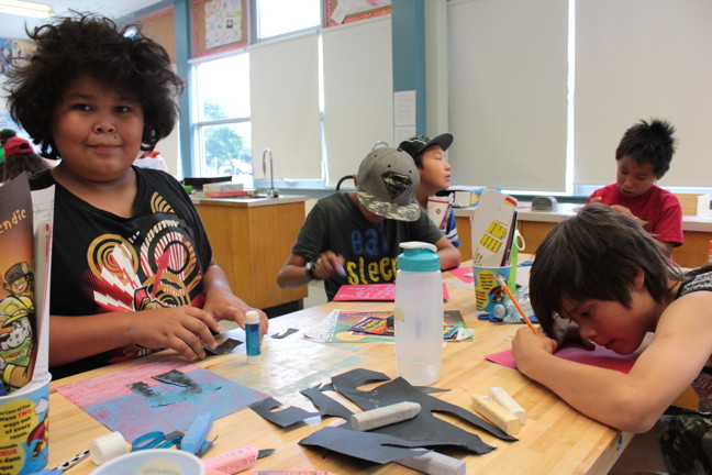 Kids attending this week's OICC day camp in Ottawa make construction paper inuksuit after a presentation on what inuksuit are used for by Dion Metcalfe. 