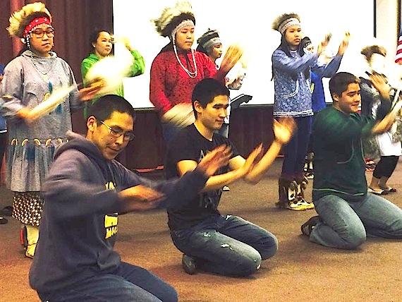 The Bethel High School Warrior Dancers perform for members of the Inuit Circumpolar Council's executive council who met this week in Bethel, Alaska. 
