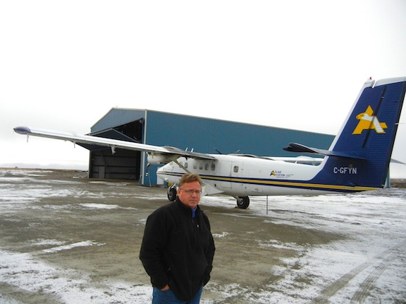 René Laserich, operations manager at Adlair Aviation Ltd., the Cambridge Bay airline his famous bush pilot father, Willy Laserich started, stands in October 2012 in front of one of the company's two hangars at the Cambridge Bay airport. (FILE PHOTO)