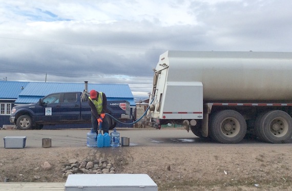 City of Iqaluit staff fill buckets of water for residents Aug. 8 in the area affected by the emergency utilidor shutdown. (PHOTO COURTESY OF JANET ARMSTRONG) 