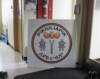 Signage for the new egg production facility in Akulivik waits to be posted. The project is called Pikliuliapik, or Where there are eggs, and should launch in the coming weeks. (PHOTO COURTESY OF DAVID QAQATUK) 