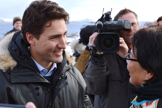 As a television camera operator shoots the scene, Liberal leader Justin Trudeau speaks to an Iqaluit resident who came to Rotary Park in Apex Oct. 10 to hear his message for Nunavut residents. (PHOTO BY STEVE DUCHARME)