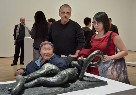 Cape Dorset artists Papiara Tukiki, left and Saimaiyu Akesuk take in Pablo Picasso’s sculpture Reclining Bather, on display at the Museum of Modern Art in New York City, accompanied by local art collector Edward J. Guarino. The artists were in New York earlier this week promoting Cape Dorset’s 2015 print collection. Tukiki and Saimaiyu took part in a panel discussion on Inuit art at the Brooklyn Museum, which is home to six prints from Cape Dorset’s very first collection in 1959. Read more about this year’s collection and the artists at NunatsiaqOnline.ca. (PHOTO BY CHERYL RONDEAU)