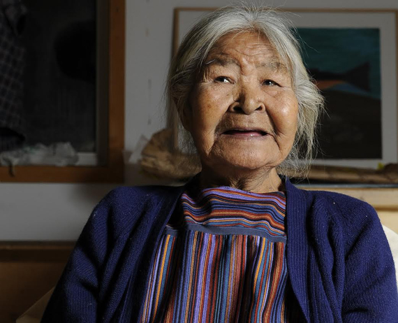Pangnirtung artist Elisapee Ishulutaq, shown here in a recent photo from the Uqqumiut centre for arts and crafts, is now 90 years old: she celebrated her 90th birthday Oct. 28. Born in 1925 in Kagiqtuqjuaq, Ishulutaq settled in what is now known as Pangnirtung in the late 1960s. That's when she started taking part in the community's new art-making program, quickly building a reputation for her carving and drawings skills. Ishulutaq, whose work is on display at the National Art Gallery in Ottawa,  is still drawing to this day. (SUBMITTED PHOTO) 