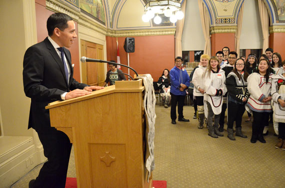 Natan Obed, president of Inuit Tapiriit Kanatami, shares a smile with Nunavut Sivuniksavut students at a meet-the-president event attended by an invited audience of MPs, diplomats, Hill staffers and Ottawa Inuit inside a Senate meeting room on Parliament Hill Nov. 26. Obed, in a short speech, said Inuit want a new relationship with the Crown, though not necessarily a 