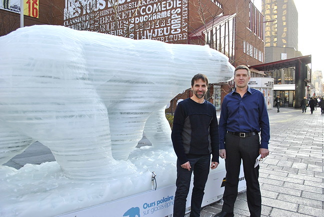 Steven Guilbeault, director of the Quebec environmental group Équiterre, and Paul Crowley, director of the World Wildlife Federation-Canada's Arctic program, introduced a piece of the Arctic to downtown Montreal this month. Ice sculptors Peter Ittukallak of Puvirnituq and Julien Doré hewed the work out of a block of ice just outside Équiterre’s offices on Ste-Catherine Street in Montreal. (PHOTO BY PETER VARGA)