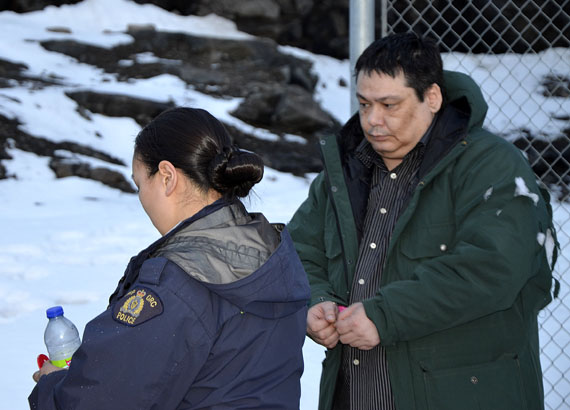 Adrian van Eindhoven is escorted to an RCMP vehicle on Oct. 15, 2013, moments after a jury at the Nunavut Court of Justice in Iqaluit convicted him of second degree murder. (FILE PHOTO)