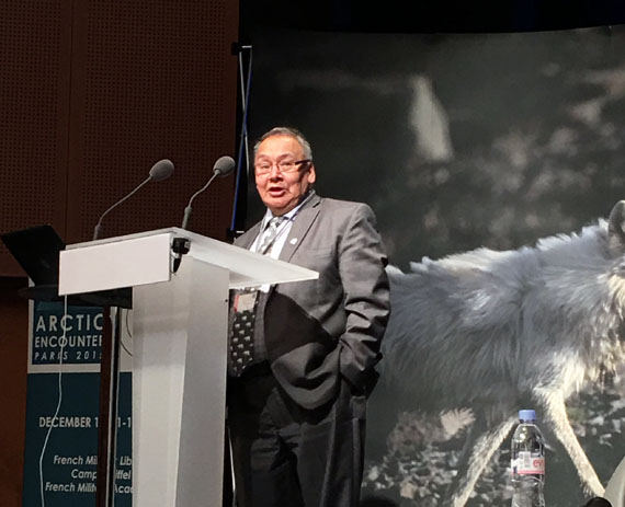 Johnny Mike, Nunavut's environment minister, delivers a keynote address to the Arctic Encounter symposium in Paris Dec. 12. (PHOTO COURTESY OF THE GN)