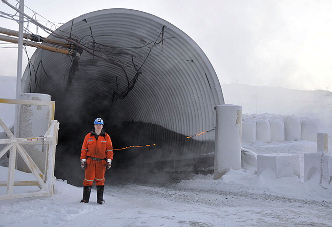 Samwillie Grey-Scott stands at the entrance of the Qakimajuq mine Dec. 2, one of four in operation at Glencore's Raglan nickel mine in Nunavik. The Raglan mine, located about halfway between Kangiqsujuaq and Salluit on Nunavik's east side, consists of high grade nickel and copper deposits and employs 950 full-time workers, according to its website. Grey-Scott, originally from Aupaluk, started working at the mine in 2010 as an apprentice miner and now trains new Inuit apprentice miners under Raglan's Tamatumani program. Nunatsiaq News reporter Sarah Rogers paid a visit to theNunavik operation this week. Read about her visit next week, on Nunatsiaqonline.ca. (PHOTO BY SARAH ROGERS)