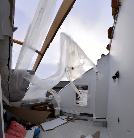 Here's what that Pangnirtung home looks from the inside after winds tore part of the roof off Jan. 12. (PHOTO BY DAVID KILABUK)