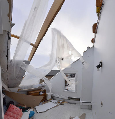 An inside view of a house in Pangnirtung that lost part of its roof in a fierce wind that swept across the community Jan. 12. (PHOTO BY DAVID KILABUK)