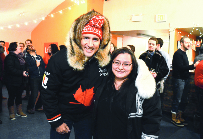 Justin Trudeau, before he was elected prime minister, visits Iqaluit in January and leaves with a parka made by Iqaluit seamstress Marlene Watson. (PHOTO BY AARON WATSON)
