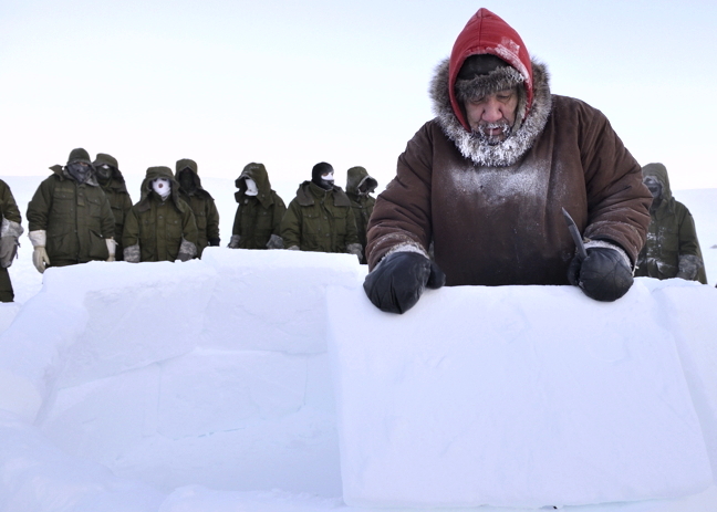 Ranger Koonerk Enoogoo, a member of 1 Canadian Ranger Patrol Group, demonstrates how to construct an igloo to members of 3rd Battalion Princess Patricia's Canadian Light Infantry during Exercise Arctic Ram 2016 in Resolute Bay, Feb. 13. Arctic Ram, the annual high Arctic cold weather training exercise is unfolding now on Cornwallis Island near Resolute Bay until Feb. 22. As part of this year's disaster scenario, roughly 120 personnel from Edmonton, Alta., are parachuting to a mock crash scene of a downed satellite. Another 120 soldiers from Winnipeg, Man., were scheduled to trek to the wreckage site overland from the Armed Forces Arctic Training Centre near Resolute’s airport. (PHOTO BY BRANDON O'CONNELL/DND CANADA)
