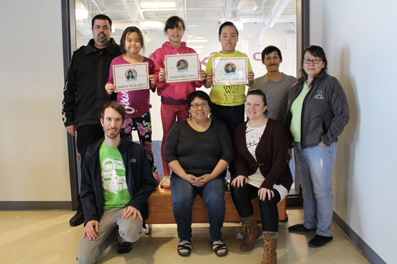 Meet the Ikaarvik Police: Three students from Ikaarvik school in Puvirnituq, Anita Aupaluk, Etuk Uhaituk, and Sorena Kanayuk, have proven their leadership skills in the school yard. The third graders are members of the Ikaarvik Police, a project launched by the KMHB’s Pivalliniq program in collaboration with the Kativik Regional Police Force. The students wear yellow vests at recess and intervene with fellow students if they see a fight or a student who is crying or hurt. Ikaarvik principal Sarah Angiyou said that since the program began, there is much less fighting at recess, and that often students will go to one of these three students for help before asking a teacher. To celebrate the students’ level two achievement, they were invited to ride around town in KRPF Captain Jean-François Morin’s police truck. (PHOTO COURTESY OF PIVALLIANIQ)
