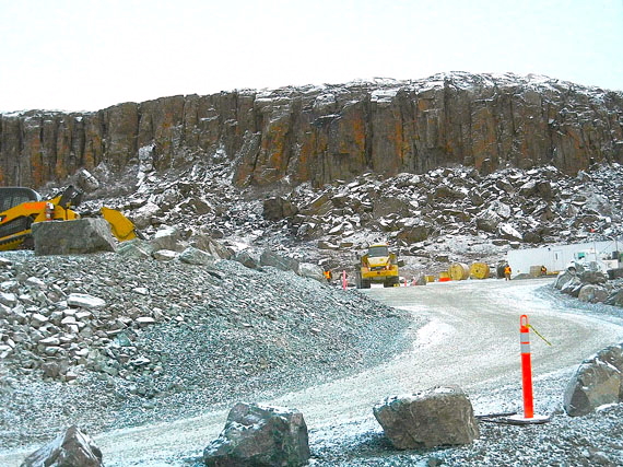 Heavy machinery operating at Doris North exploration site prior to TMAC Resources Inc.’s acquisition of the gold mine project in 2013. At a three-day Nunavut Impact Review Board hearing in Cambridge Bay this week that started April 12, the review board will consider a request from TMAC to amend an existing project certificate, granted in 2006 to Miramar Mining Corp., a previous owner. Right now, TMAC already holds all necessary permits and licenses it needs to start mining at Doris North, part of the large Hope Bay gold field — but only for two years. Now, the company wants NIRB to amend the project certificate to allow for an expanded six-year mining period over a larger area. The NIRB will hear from stakeholder groups that include the Kitikmeot Inuit Association, the Government of Nunavut and several federal departments on proposed changes to infrastructure and water and tailings disposal. Read more later on Nunatsiaqonline.ca about the hearing. (PHOTO BY JANE GEORGE)
