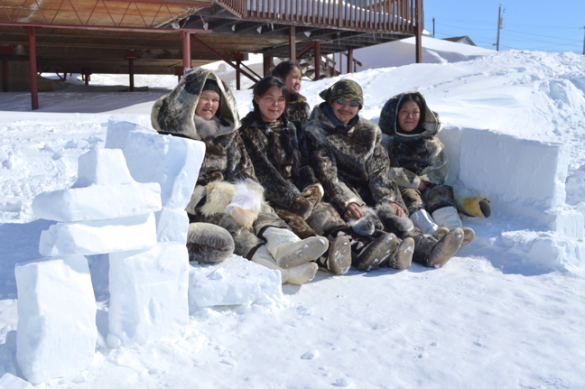 Fancy some old style living in the North? Members of the Tukisigiarvik Society settle into their traditional winter village across from the Tammaativvik Boarding Home in Iqaluit April 22, built as part of Toonik Tyme festivities. (PHOTO BY STEVE DUCHARME)