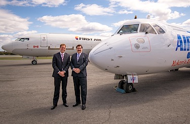 Bert van der Stege, Vice President Commercial at First Air, stands with Joe Sparling, President of Air North, in front of their respective company jets in a photo released May 11. (HANDOUT PHOTO)